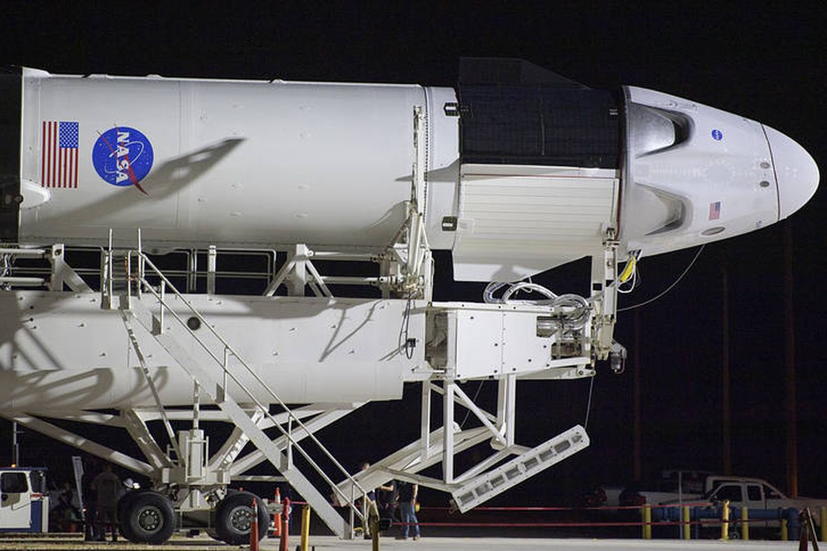 A SpaceX Falcon 9 rocket with the companys Crew Dragon spacecraft onboard is seen as it is rolled out of the horizontal integration facility at Launch Complex 39A as preparations continue for the Demo-2 mission, Thursday, May 21, 2020, at NASA?s Kennedy Space Center in Florida. NASA?s SpaceX Demo-2 mission is the first launch with astronauts of the SpaceX Crew Dragon spacecraft and Falcon 9 rocket to the International Space Station as part of the agency?s Commercial Crew Program. The flight test will serve as an end-to-end demonstration of SpaceX?s crew transportation system. Behnken and Hurley are scheduled to launch at 4:33 p.m. EDT on Wednesday, May 27, from Launch Complex 39A at the Kennedy Space Center. A new era of human spaceflight is set to begin as American astronauts once again launch on an American rocket from American soil to low-Earth orbit for the first time since the conclusion of the Space Shuttle Program in 2011. Photo Credit: (NASA/Bill Ingalls)
