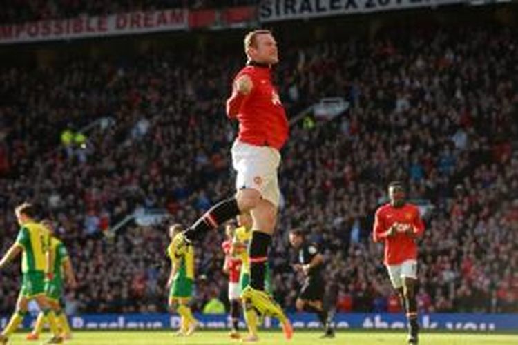 Selebrasi bomber Manchester United, Wayne Rooney, seusai membobol gawang Norwich City dalam lanjutan Premier League, Sabtu (27/4/2014). 