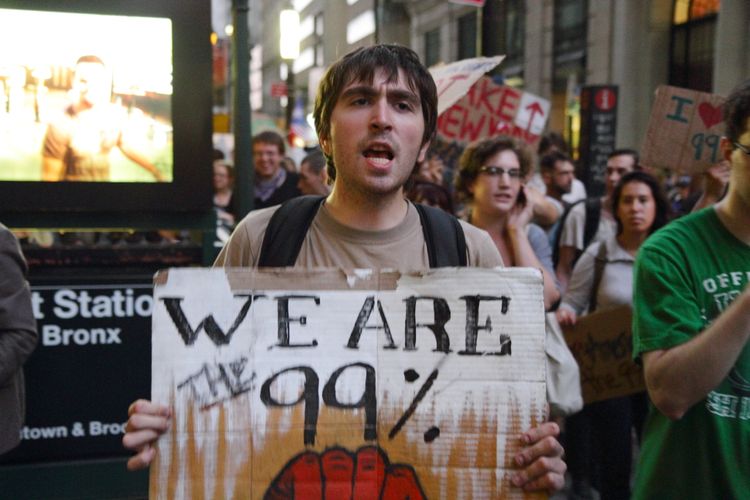 Slogan 99 persen yang menjadi ikon kelompok Occupy Wall Street melawan ketidakadilan dalam sistem kapitalisme.