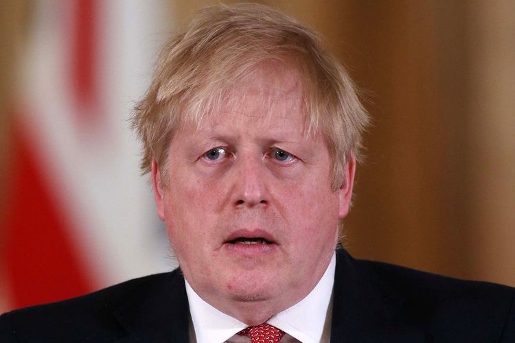 Perdana Menteri Inggris Boris Johnson menggelar konferensi pers guna memberi keterangan harian terkait respons pemerintah melawan wabah virus corona (Covid-19) di Downing Street 10, London, pada 22 Maret 2020. Johnson menyatakan dia terkena virus corona.