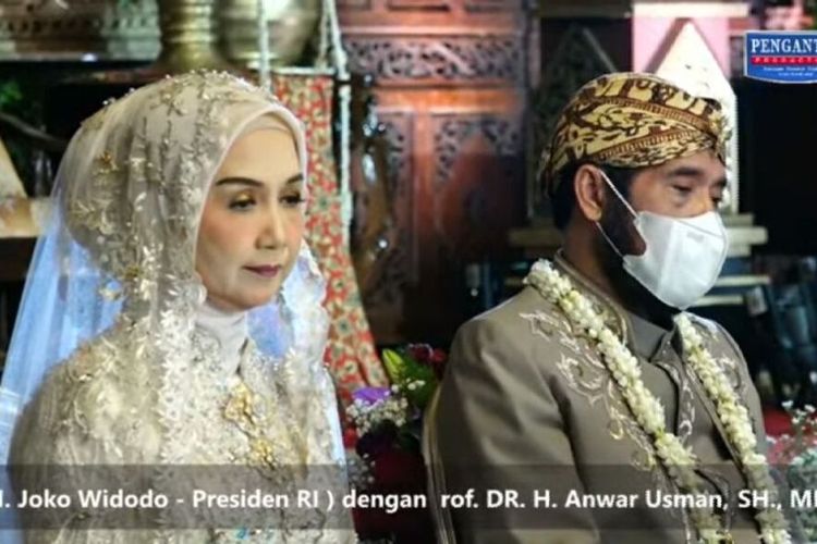 Tangkap layar posesi Akad nikah pernikahan adik Presiden Jokowi, Idayati dengan Ketua Mahkamah Konstitusi (MK) Anwar Usman. Presiden Joko Widodo (Jokowi) menjadi wali nikah, Wakil Presiden Ma'ruf Amin dan Panglima TNI Jenderal Andika Perkasa tetap menjadi saksi nikah.Prosesi akad nikah dilaksanakan pada pukul 09.00 WIB, di Gedung Graha Shaba Buana, Jalan Letjen Suprapto Nomor 80-B, Kelurahan Sumber, Kecamatan Banjarsari, Kota Solo, Jawa Tengah