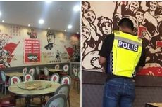 Foto Viral Polisi Malaysia Copot Stiker Komunis dari Sebuah Restoran
