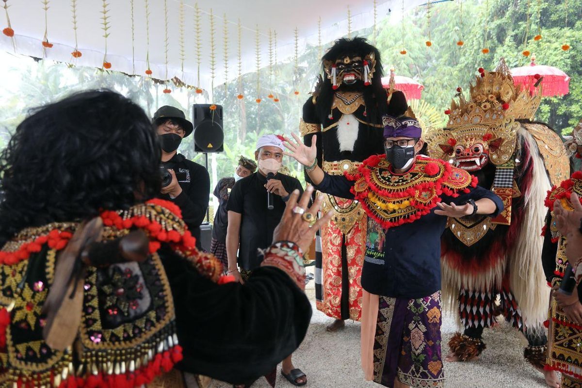 Tourism and Creative Economy Minister Sandiaga Uno participates in a Balinese Dance when visiting a tourist village in Carangsari, Badung regency in Bali on Saturday, September 9, 2021. 