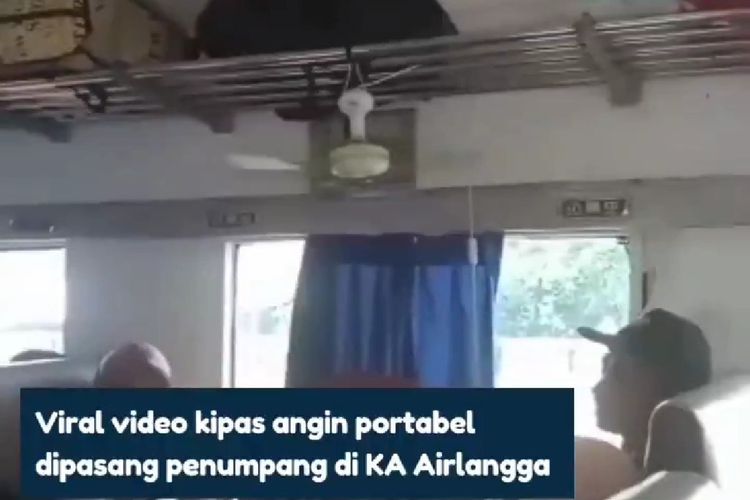 Tangkapan layar video penumpang menyalakan kipas angin melalui colokan listrik di gerbong kereta api.