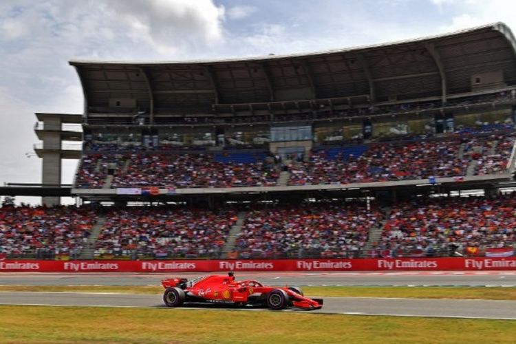 Pebalap Ferrari, Sebastian Vettel, menjadi yang tercepat di Sirkuit Hockenheimring pada sesi kualifikasi GP Jerman, 21 Juli 2018. 