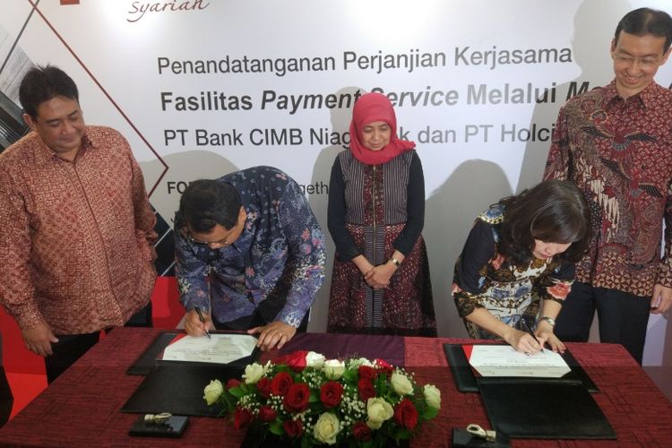 PT Holcim lndonesia Tbk (Holcim Indonesia) bekerja sama dengan PT Bank CIMB Niaga Tbk (CIMB Niaga) untuk menyediakan aplikasi pembelian material, Rabu (10/5/2017).