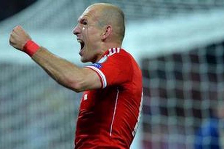 Ekspresi gelandang sayap Bayern Muenche, Arjen Robben, setelah memastikan klubnya juara Liga Champions 2013. Bayern sukses mengalahkan Borussia Dortmund di Stadion Wembley, London, Sabtu atau Minggu (26/5/2013) dini hari WIB.