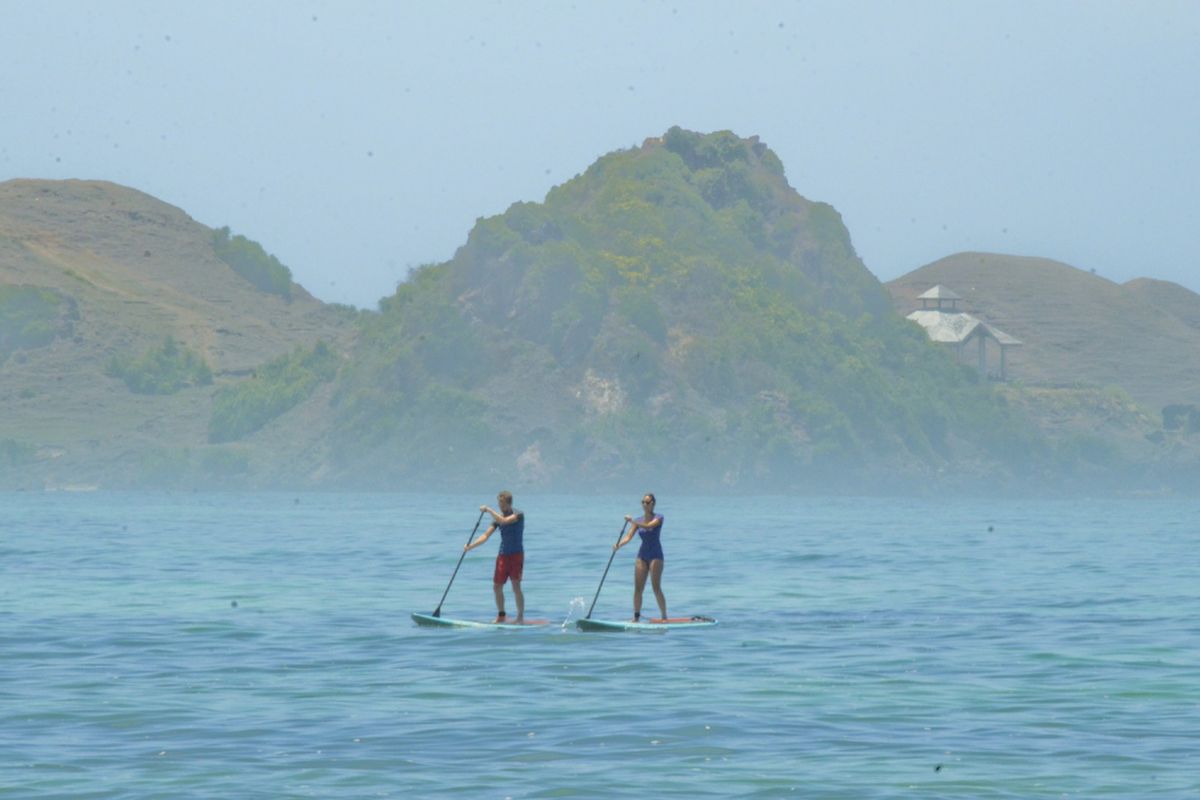 The stunning scenery and smooth waves of Tanjung Aan Beach make it one of the go-to places to visit for surfing in Lombok, Indonesia.