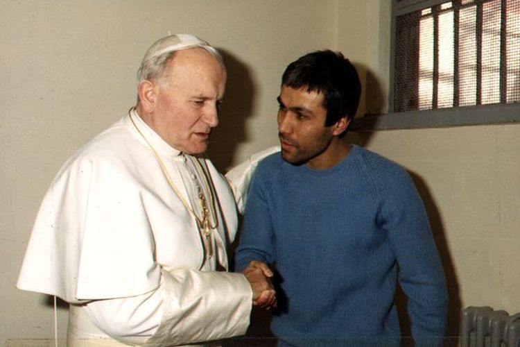 Pope John Paul meets with his would-be assassin, Turkish gunman Mehmet Ali Agca, in a cell of Romes Rebibbia prison in this December 27, 1983 photo (Daily Mirror)