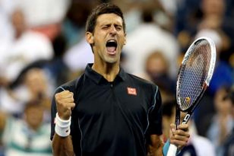Petenis Serbia, Novak Djokovic berteriak setelah memastikan kemenangan atas Mikhail Youzhny dari Rusia, pada babak perempat final US Open yang berlangsung di USTA Billie Jean King National Tennis Center, New York, Kamis (5/9/2013).
