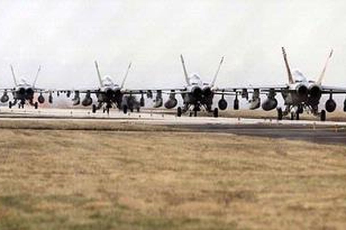 Prepared: F-18 fighters are parked at the NATO airbase in Aviano, Italy. International leaders have said Libya could face military action if it refuses to comply with UN resolution  