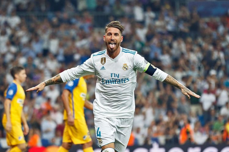 Kapten Real Madrid, Sergio Ramos, melakukan selebarasi usai mencetak gol ke gawang APOEL.