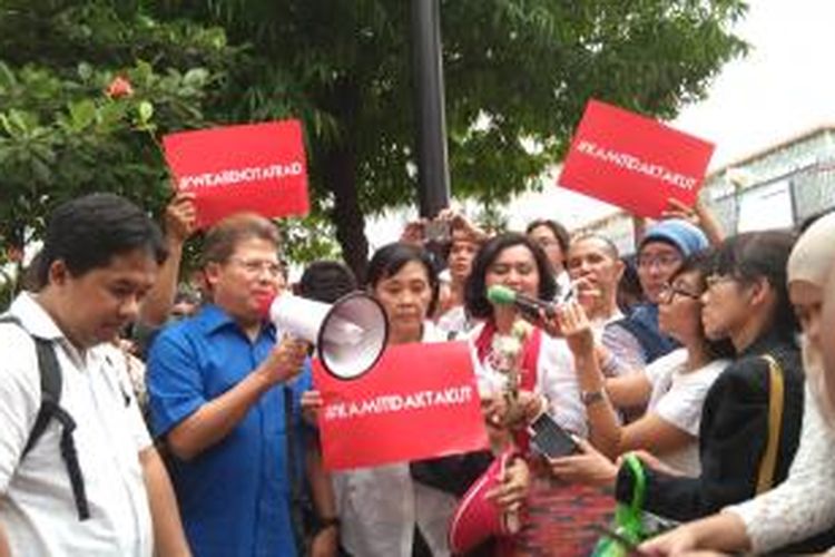 Aksi solidaritas di Jalan M.H Thamrin, Jumat (15/1/2016). 