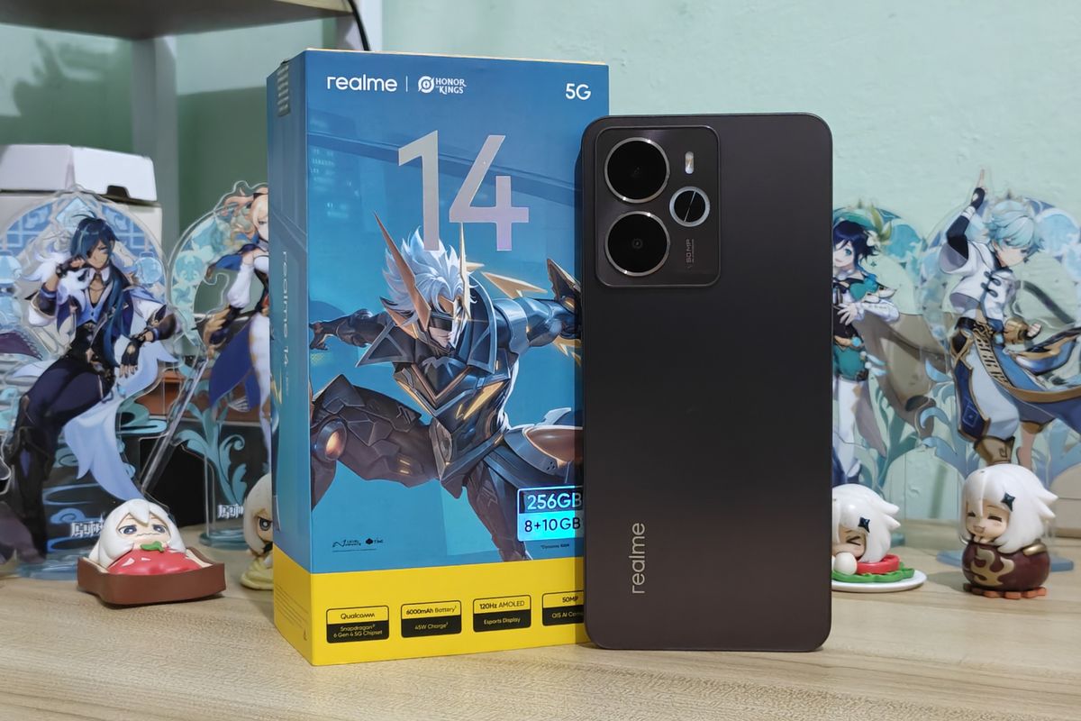 Kotak ritel Realme 14 5G yang dihiasi karakter Honor of Kings bersama unit ponselnya.
