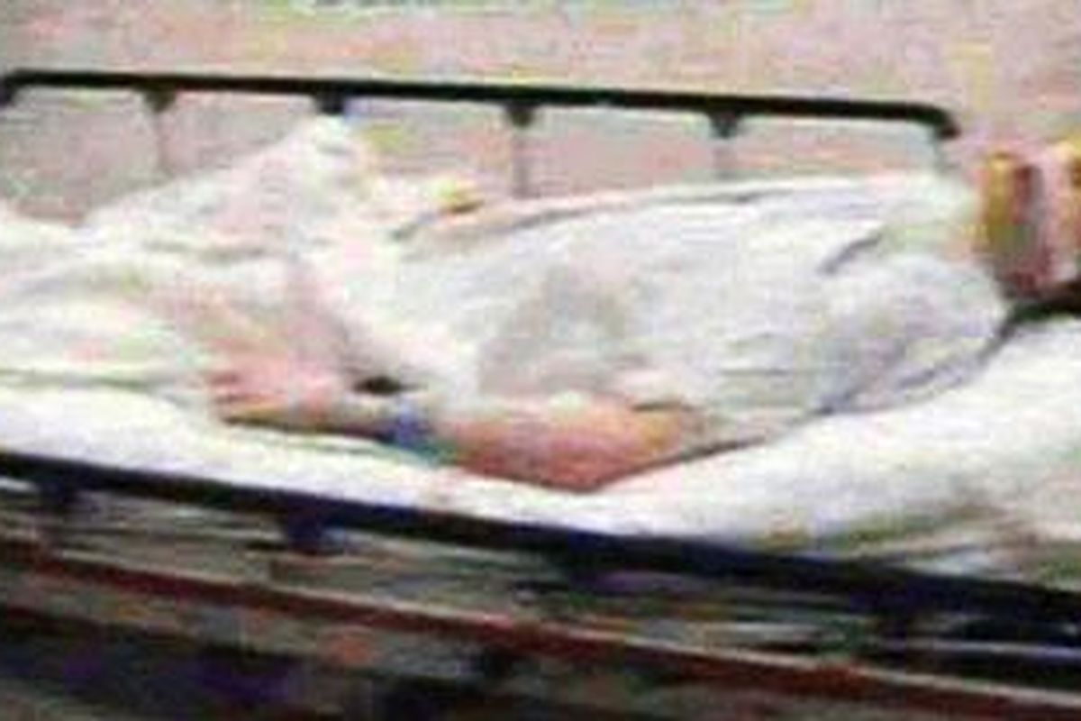 Shocking: Photo apparently showing Michael Jackson's dead body on a gurney on the opening day of the trial of Dr Conrad Murray  