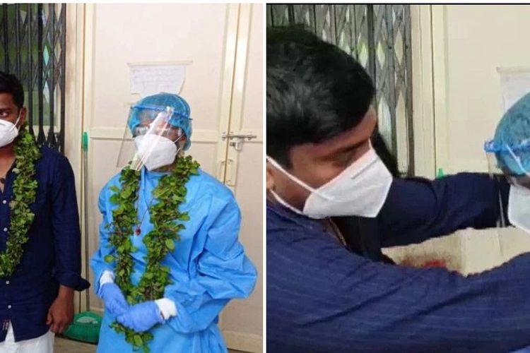 Sarathmon S (kiri) ketika mengalungkan bunga ke istrinya, Abhirami, yang memakai Alat Pelindung Diri (APD) di rumah sakit Kerala, India. Pasangan itu menikah di rumah sakit setelah Sarathmon diketahui positif Covid-19.