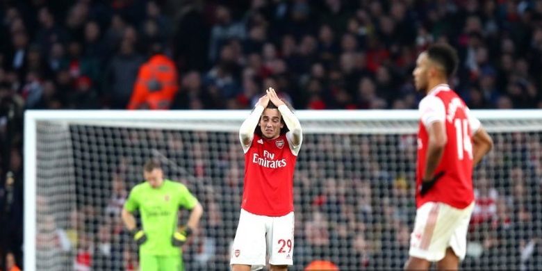 Ekspresi pemain Arsenal, Matteo Guendouzi dab Pierre-Emerick Aubameyang pada laga Arsenal vs Chelsea dalam lanjutan pekan ke-20 Liga Inggris 2019-2020.