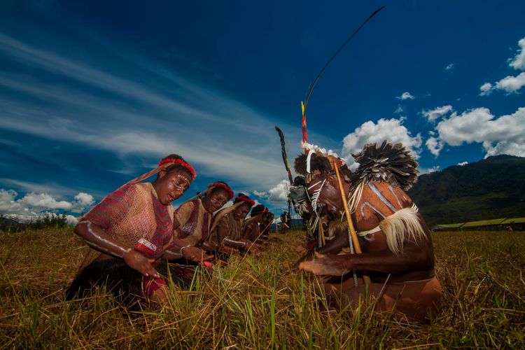 Some of the villagers in Papua are gathered to attend the Baliem Valley Cultural Festival in Wamena, Papua. The photo was taken before the Covid-19 pandemic.  