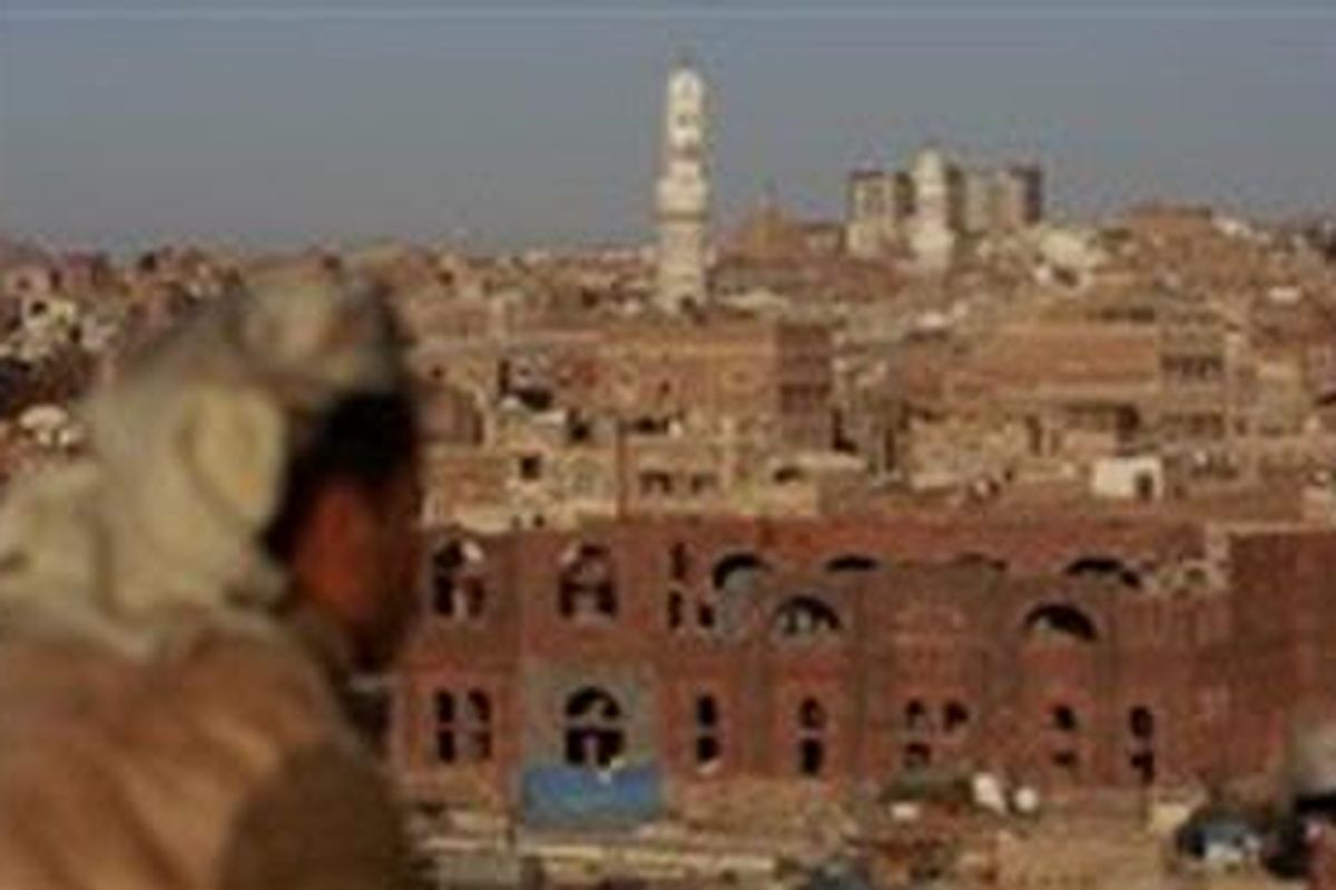 A Yemeni man looks towards Sanaas Old City on January 15, 2010. An air strike on an Al-Qaeda in the Arabian Peninsula AQAP position in north Yemen killed six suspected leaders of the group including its military boss.