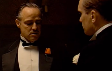 Tangkapan layar film The Godfather, saat consigliere Tom Hagen bersama bos mafia Don Vito Corleone