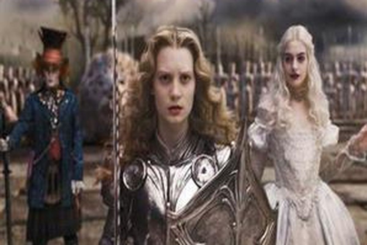 In this film publicity image released by Disney, Johnny Depp, left, Mia Wasikowska, center, and Anne Hathaway are shown in a scene from the film Alice in Wonderland. Audiences are mad as hatters about Johnny Depp and Tim Burtons Alice in Wonderland, helping it earn a whopping USD41 million in its first day, Friday, March 5, 2010. 