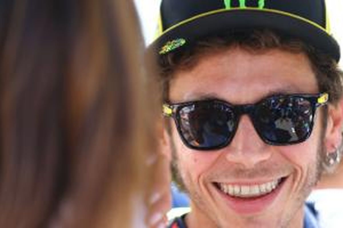 Muka ceria Valentino Rossi untuk membalap di Sachsenring, (13/7/2014).