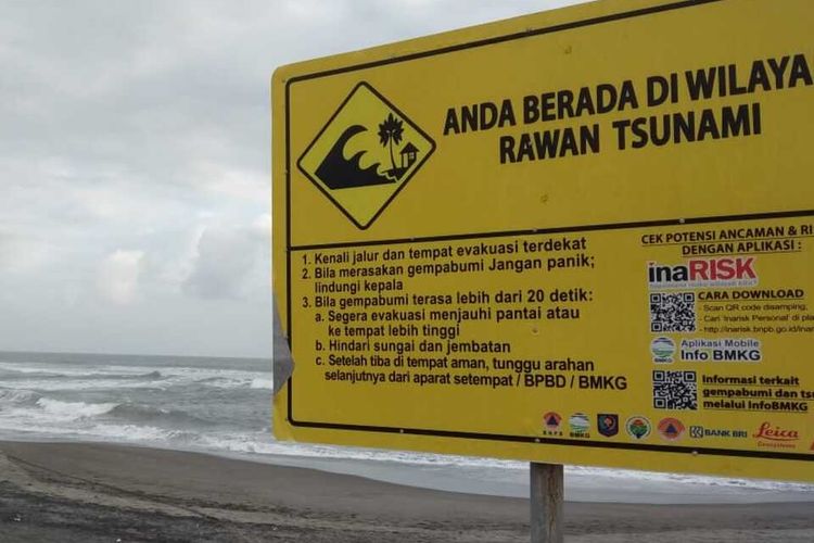 A tsunami warning board on a beach in Cianjur, West Java