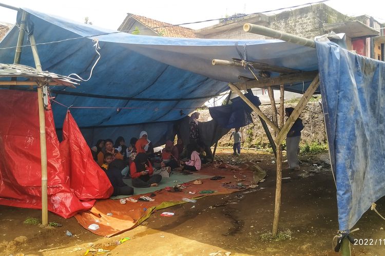Some residents gather at a shelter in a village in Sukabumi on Tuesday, November 22, 2022 a day after the 5.6-magnitude quake struck Indonesia's West Java. 