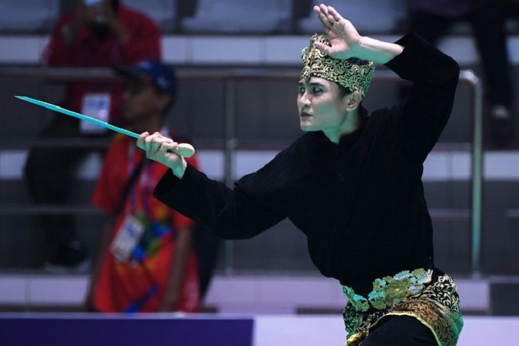 Sugianto tampil pada babak penyisihan pencak silat Asian Games 2018, 25 Agustus 2018. 