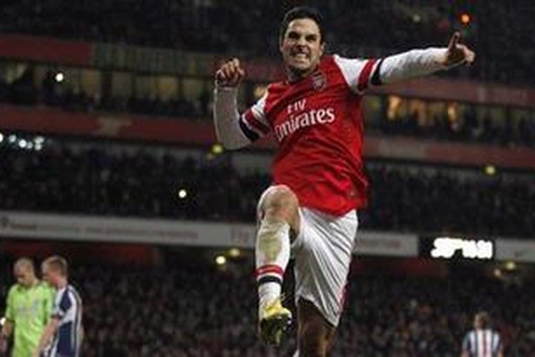 Gelandang Arsenal, Mikel Arteta, merayakan gol penalti yang dicetaknya ke gawang West Bromwich Albion di Stadion Emirates, Sabtu (8/12/2012). Arsenal menang 2-0 melalui dua gol penalti Arteta.