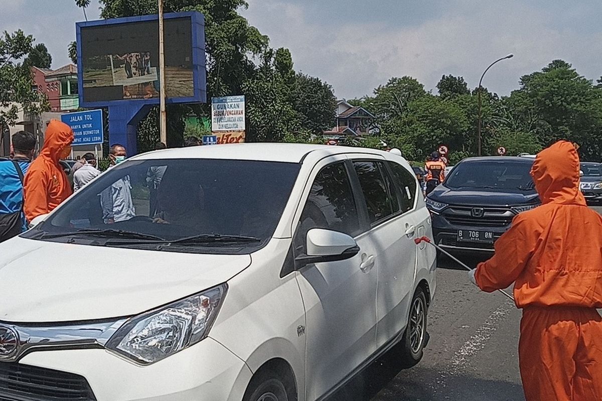 Members of the Covid-19 Task Force in Bogor regency check on the motorists who want to spend their holidays in Puncak tourist area in West Java. 