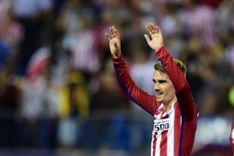 Antoine Griezmann merayakan gol kemenangan Atletico Madrid ke gawang Getafe, Selasa (22/9/2015). 