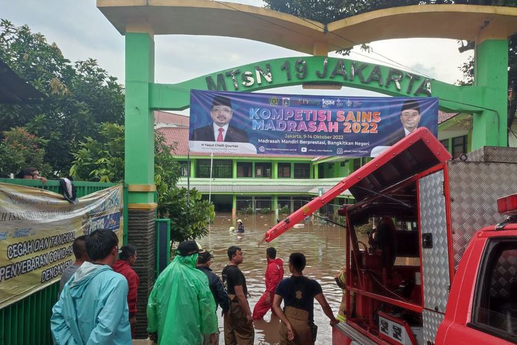 At least three people died in Indonesia Thursday, Oct. 6, 2022 after a flood in capital Jakarta surged into a school and caused a wall to collapse. 