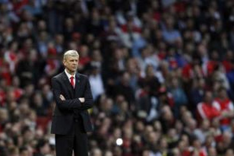 Ekspresi manajer Arsenal, Arsene Wenger, pada laga melawan Swansea di Stadion Emirates, London, Senin (11/5/2015).