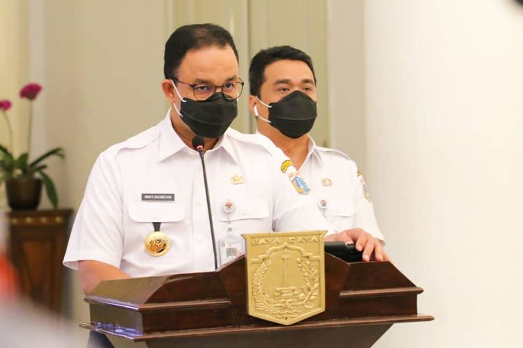 Jakarta Governor Anies Baswedan (left), who is accompanied by his deputy Achmad Riza Patria, announces his decision to reimpose partial lockdown from September 14 to stem the spread of the Covid-19 in the Indonesian capital. 