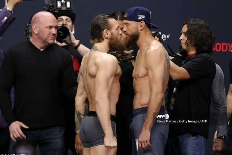 Conor McGregor dan Donald Cerrone berhadapan pada sesi konferensi pers jelang UFC 246. Keduanya akan berduel di kelas welterweight pada main event UFC 246 di T-Mobile Arena, Las Vegas, Nevada.