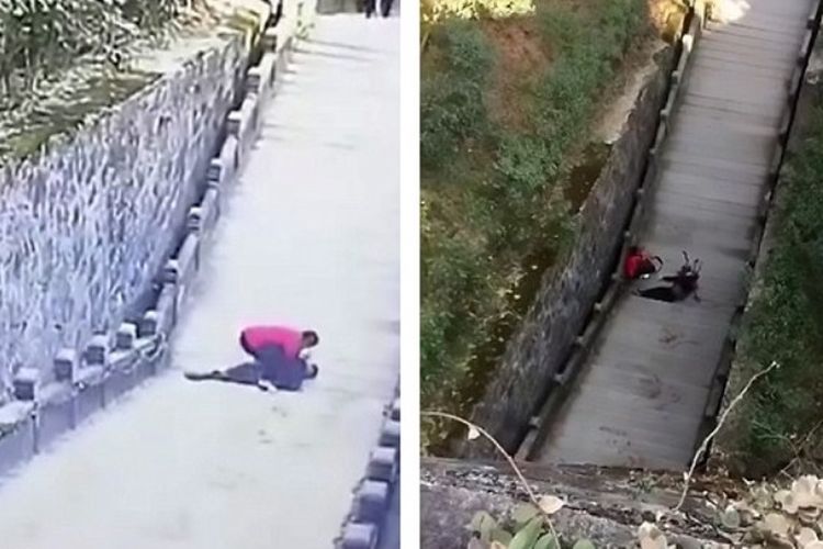 Foto yang diambil dari kamera CCTV ini memperlihatkan seorang pria berusaha menolong seorang pemuda yang terjatuh dari tebing di tempat wisata Gunung Jiuhua, China.