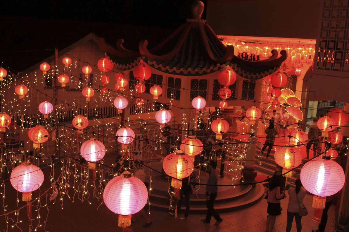 A temple in Palembang, South Sumatera is alight with red paper lanterns during the Lunar New Year's eve on Monday, Jan. 31, 2022.  