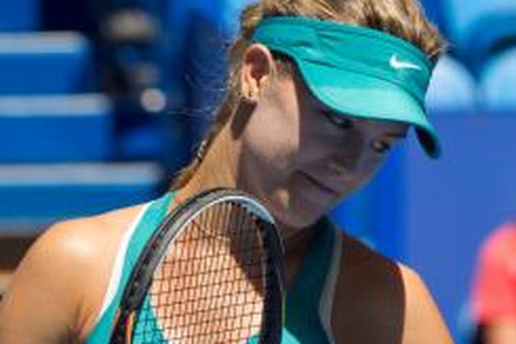 Petenis Kanada, Eugenie Bouchard, bereaksi saat menghadapi petenis Ceko, Lucie Safarova, pada pertandingan penyisihan grup Hopman Cup di Perth, Minggu (4/1/2015).