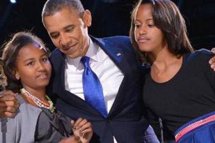 Presiden Barack Obama bersama kedua putrinya Maila dan Sasha.