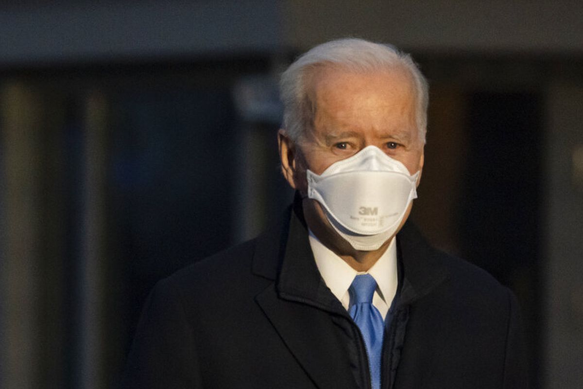 Presiden Joe Biden berhenti untuk berbicara dengan wartawan saat dia berjalan ke Marine One untuk berangkat dari South Lawn Gedung Putih ke Camp David, Jumat (12/2/2021) 