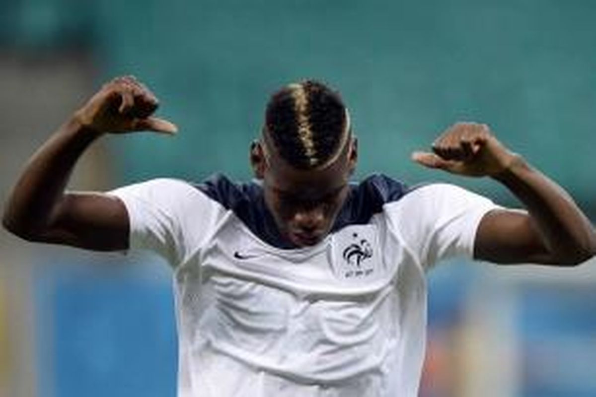 Pemain tengah Perancis Paul Pogba saat sesi latihan di Fonte Nova Arena, di Salvador, 19 Juni 2014.