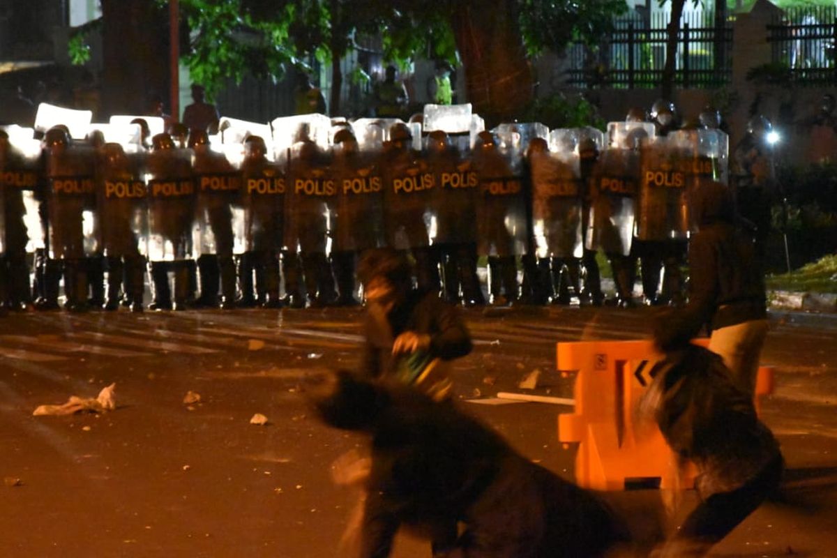 People stage protest against the new job creation law in Bandung, West Java on Tuesday, October 6, 2020. 