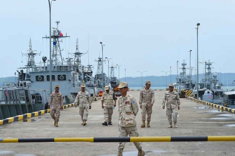 File photo of Cambodian navy personnel walk on a jetty in Ream naval base in Preah Sihanouk province during a government organized media tour dated on July 26, 2019.