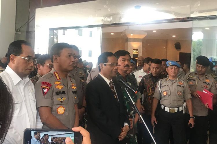 Menteri Koordinator Bidang Politik, Hukum, dan Keamanan (Menko Polhukam) Mahfud MD di Auditorium Mutiara Perguruan Tinggi Ilmu Kepolisian (PTIK), Jakarta Selatan, Jumat (13/12/2019).