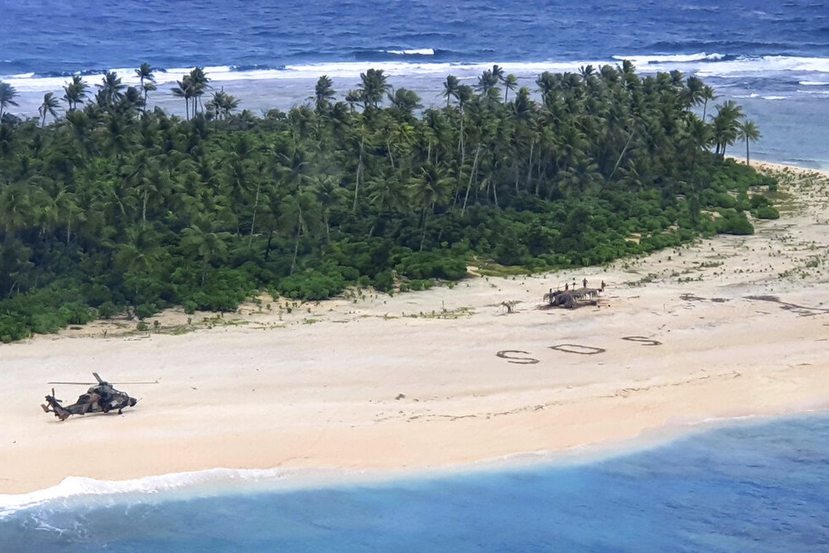 Three rescued men are now safe after their giant SOS sign in the sand helped to get the rescued from a tiny Pacific island.