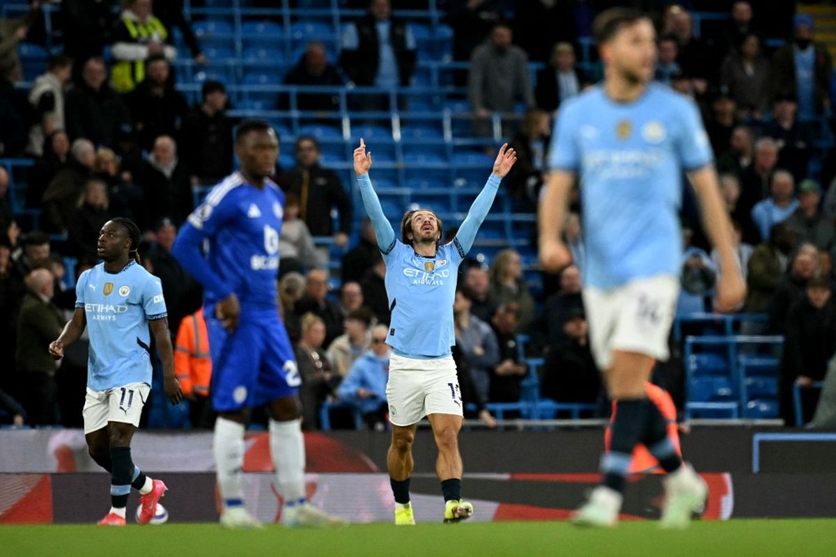 Jack Grealish mengemas gol dalam partai pekan ke-30 Liga Inggris 2024-2025 antara Man City vs Leicester yang digelar di Stadion Etihad, Rabu (2/4/2025) atau Kamis dini hari WIB. (Photo by Oli SCARFF / AFP) 