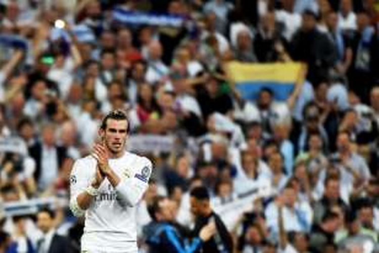 Winger Real Madrid, Gareth Bale, merayakan keberhasilan timnya lolos ke final Liga Champions. 