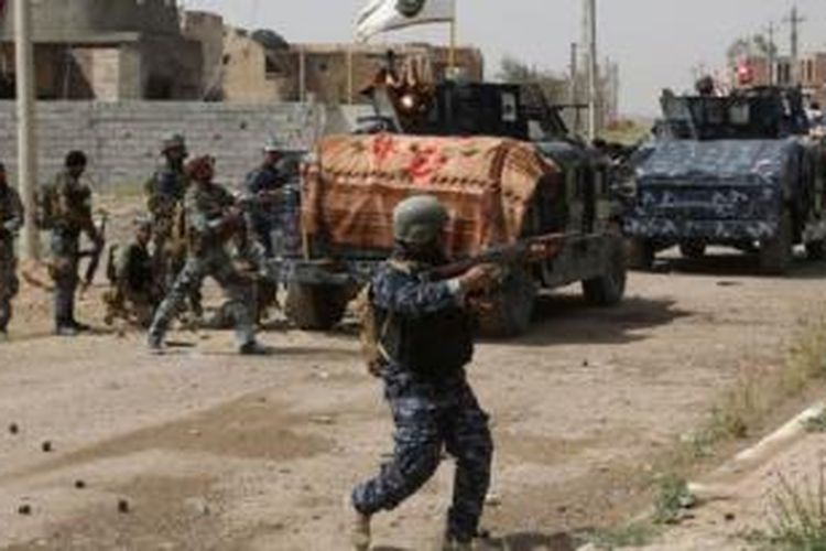 Pasukan keamanan Irak berhasil mengusir militan ISIS dari kota Tikrit di utara Baghdad. Foto diambil 30 Maret 2015.