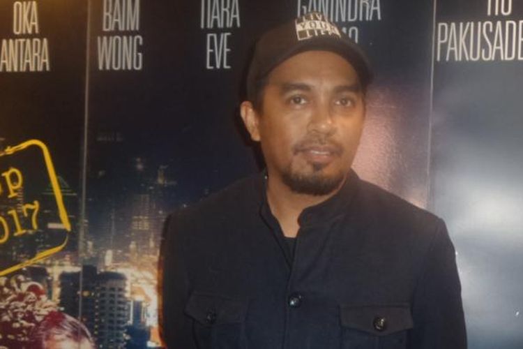 Glenn Fredly menghadiri pemutaran perdana film Jakarta Undercover di Epicentrum Walk XXI, Kuningan, Jakarta Selatan, pada Selasa (21/2/2017).